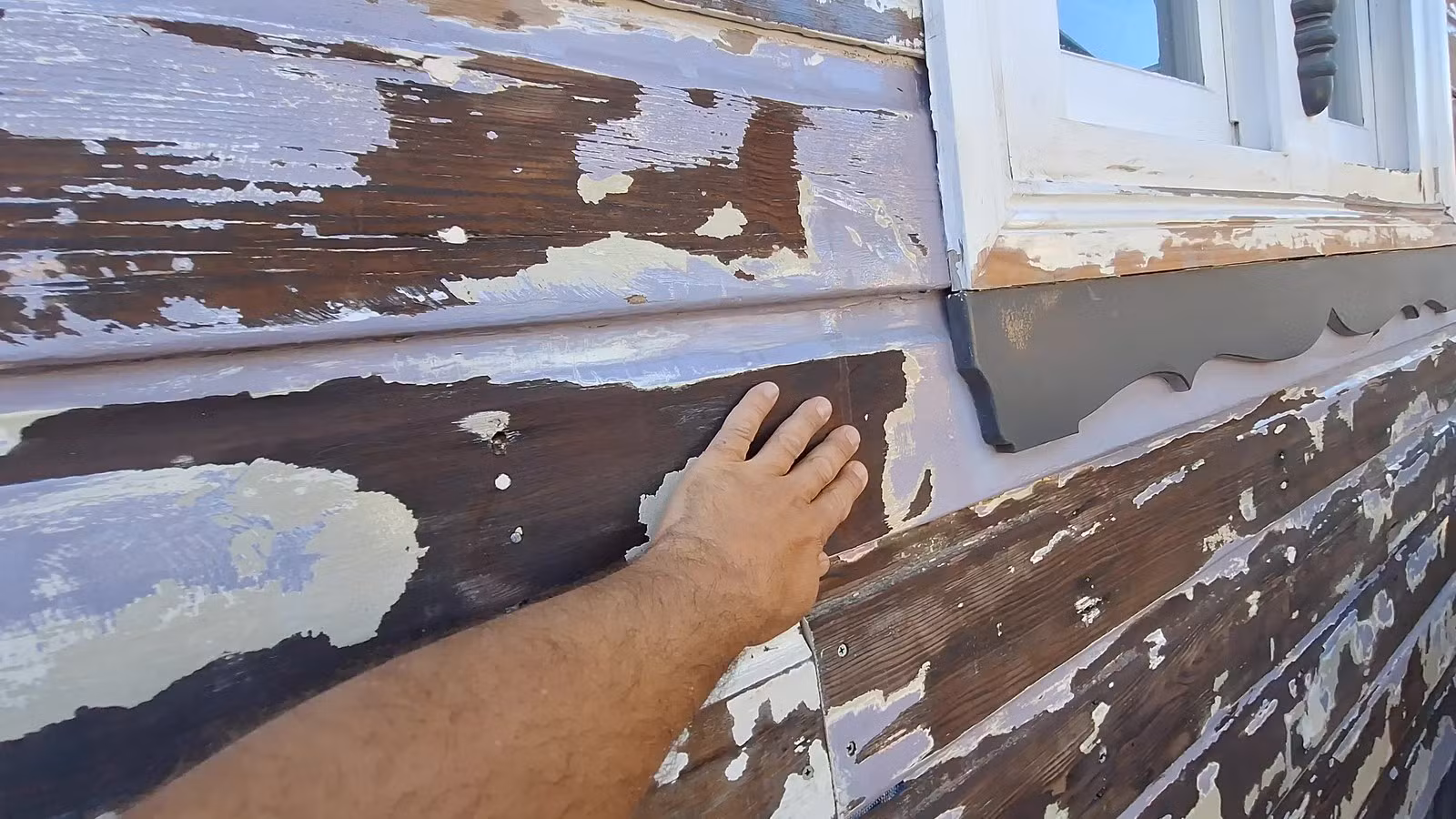 Weatherboards with filled and prepared areas before undercoating and finish coats