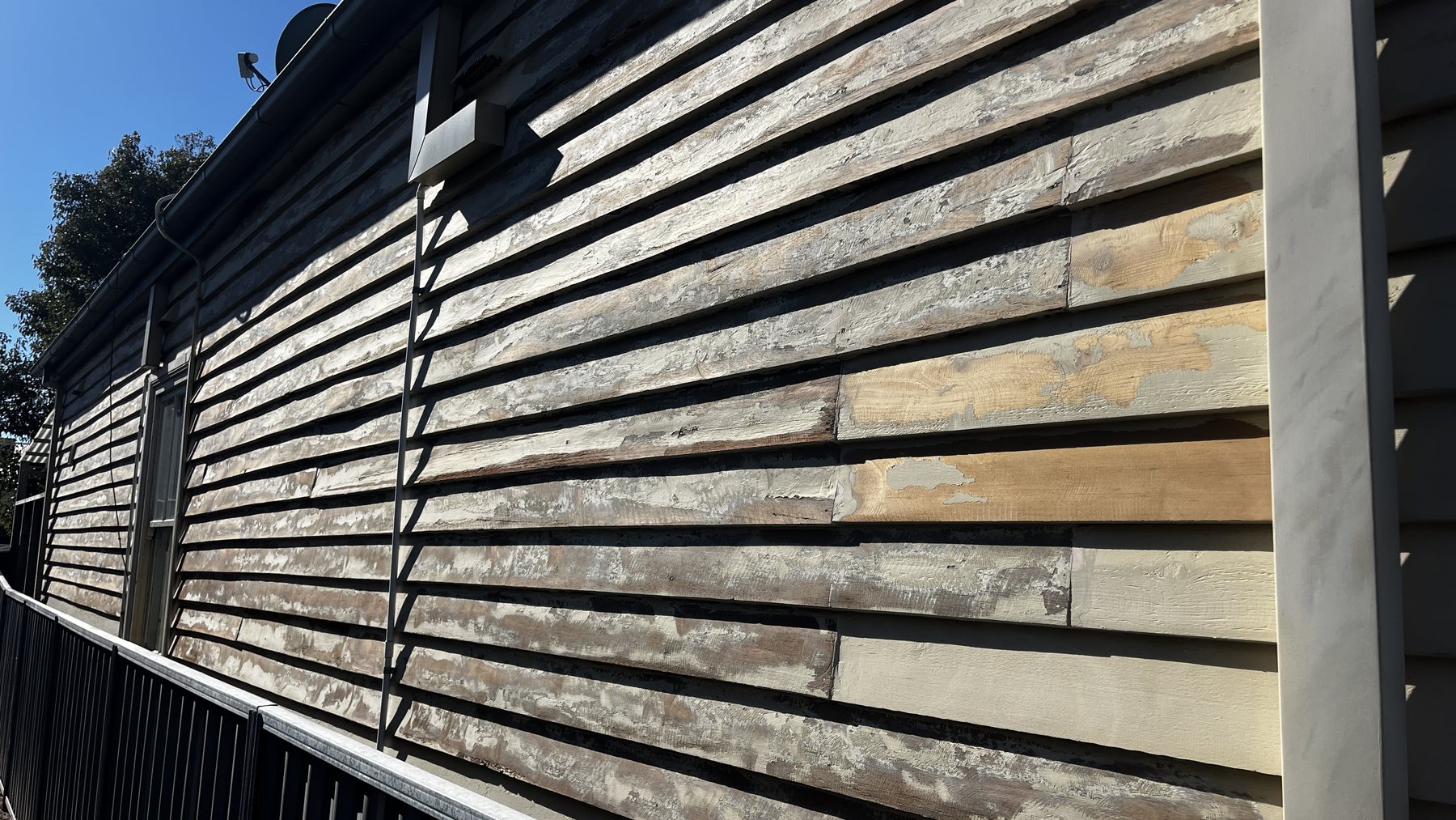 Mechanical preparation of peeling weatherboard paint