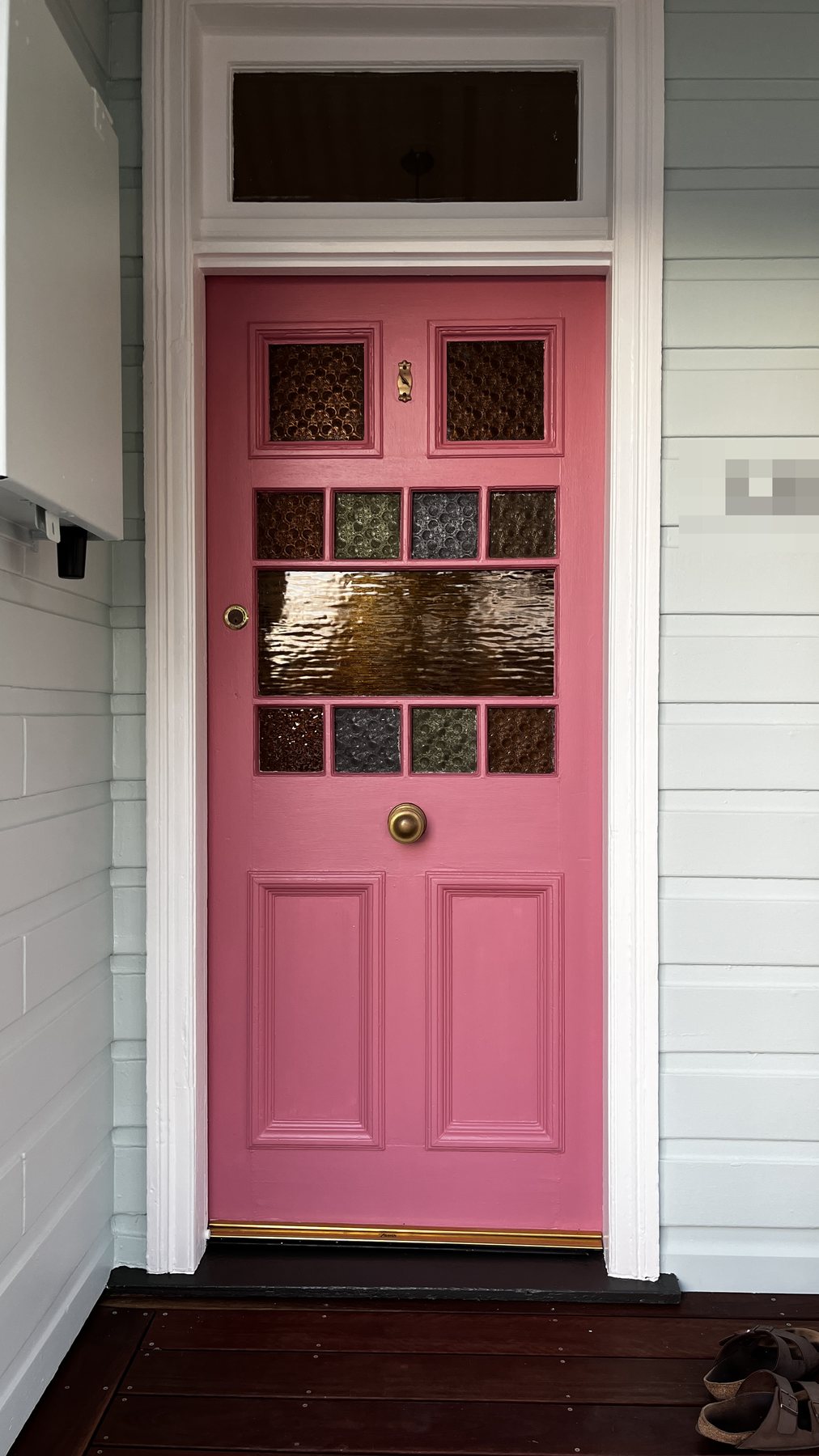 Finished rose-coloured front door after repainting
