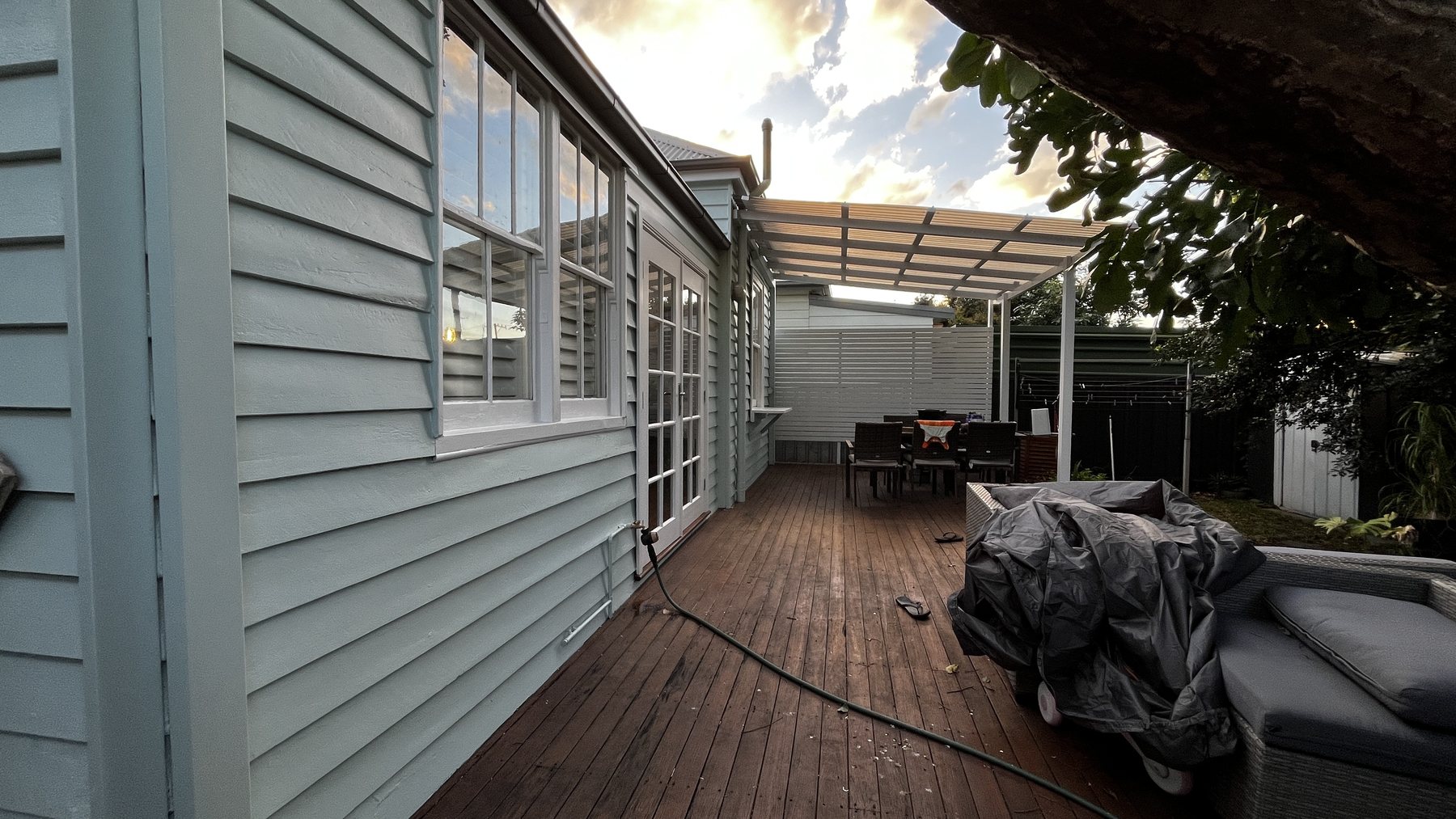 Rear weatherboards and windows after exterior repainting